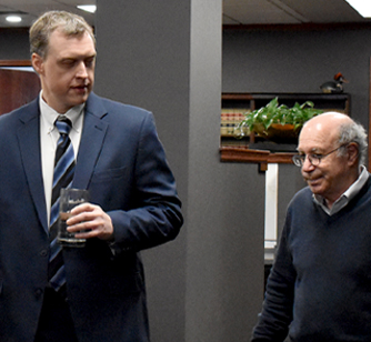 Two Attorneys chatting in the halls at McDowell Rice Law Firm